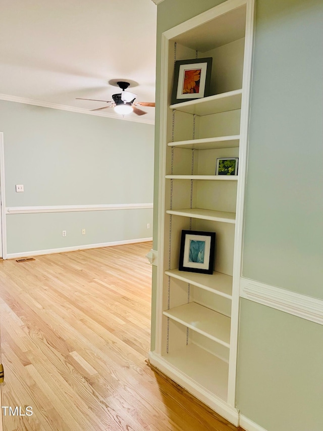 1512 Cumberland Rd, Chapel Hill, NC 27514 - detailed view of wood finished floors, ceiling fan, baseboards, and ornamental molding