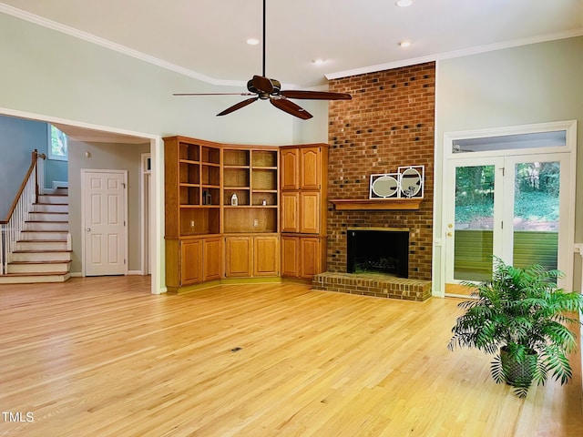 1512 Cumberland Rd, Chapel Hill, NC 27514 - unfurnished living room with ceiling fan, light wood-type flooring, stairs, ornamental molding, and a fireplace