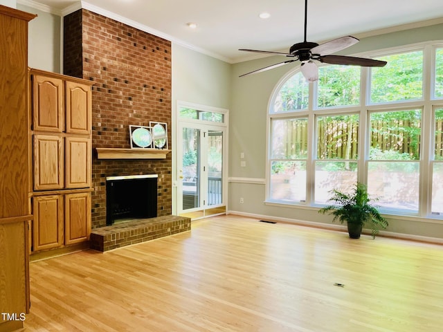 1512 Cumberland Rd, Chapel Hill, NC 27514 - unfurnished living room with a ceiling fan, light wood-style flooring, crown molding, a fireplace, and baseboards