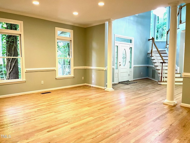 1512 Cumberland Rd, Chapel Hill, NC 27514 - entryway featuring crown molding, ornate columns, wood finished floors, baseboards, and stairs