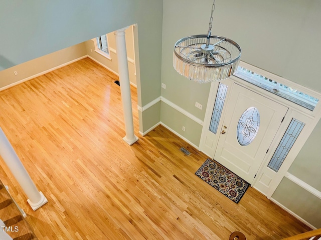 1512 Cumberland Rd, Chapel Hill, NC 27514 - foyer entrance featuring wood finished floors, ornate columns, and baseboards