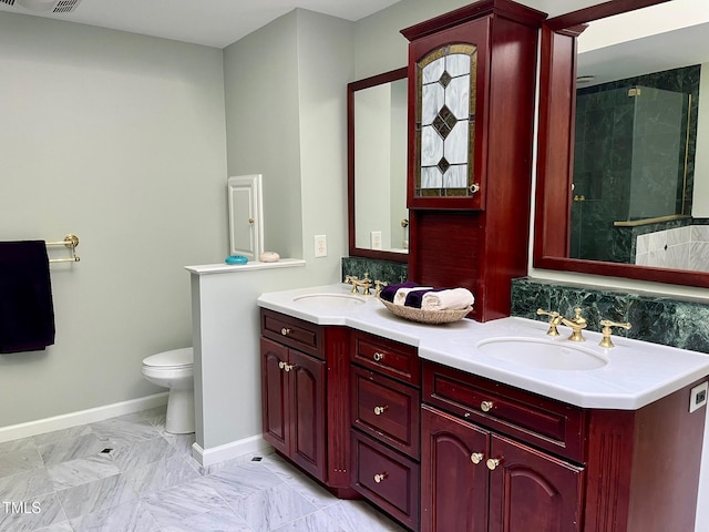 1512 Cumberland Rd, Chapel Hill, NC 27514 - bathroom featuring double vanity, toilet, tiled shower, baseboards, and marble finish floors
