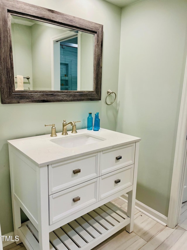 1512 Cumberland Rd, Chapel Hill, NC 27514 - bathroom featuring vanity, wood finished floors, and baseboards