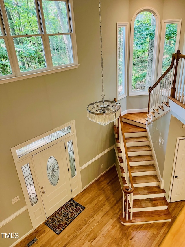 1512 Cumberland Rd, Chapel Hill, NC 27514 - entryway featuring plenty of natural light, baseboards, light wood finished floors, and stairs