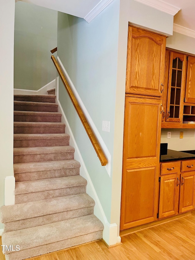 1512 Cumberland Rd, Chapel Hill, NC 27514 - stairway featuring crown molding, wood finished floors, and baseboards