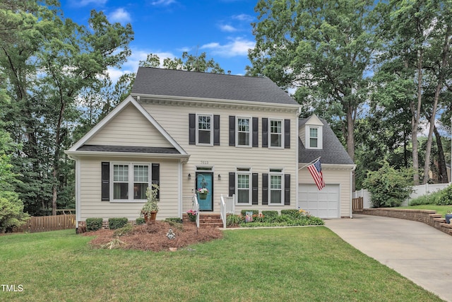 7613 Percy Ct, Raleigh, NC 27613 - view of front of home featuring concrete driveway, a garage, roof with shingles, and entry steps