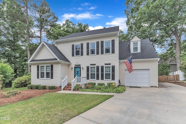 7613 Percy Ct, Raleigh, NC 27613 - view of front of home with concrete driveway, an attached garage, and a shingled roof