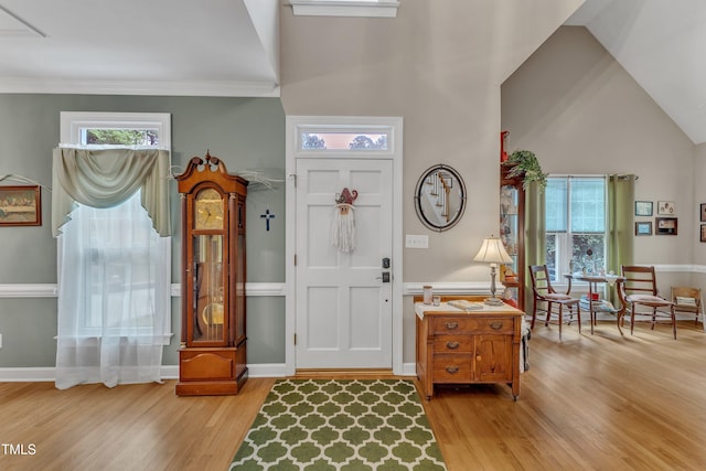 7613 Percy Ct, Raleigh, NC 27613 - entrance foyer with high vaulted ceiling, light wood finished floors, plenty of natural light, and a wainscoted wall