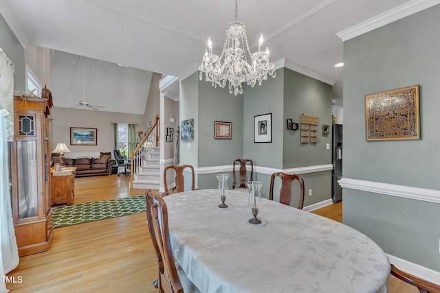 7613 Percy Ct, Raleigh, NC 27613 - dining room featuring stairway, light wood-type flooring, baseboards, ceiling fan, and crown molding