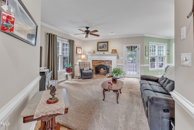 7613 Percy Ct, Raleigh, NC 27613 - carpeted living room featuring a fireplace, a ceiling fan, ornamental molding, and baseboards