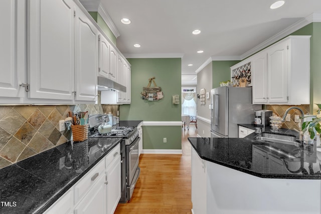 7613 Percy Ct, Raleigh, NC 27613 - kitchen featuring stainless steel appliances, a sink, under cabinet range hood, white cabinetry, and ornamental molding