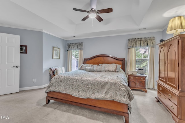 7613 Percy Ct, Raleigh, NC 27613 - bedroom featuring light carpet, a tray ceiling, multiple windows, baseboards, and crown molding
