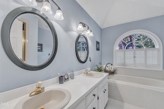 7613 Percy Ct, Raleigh, NC 27613 - bathroom with lofted ceiling, double vanity, a bath, and tile patterned floors