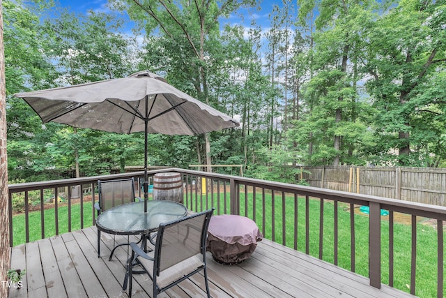 7613 Percy Ct, Raleigh, NC 27613 - deck featuring outdoor dining area and view of wooded area
