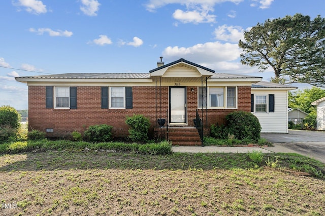 3115 Legion Rd, Hope Mills, NC 28348 - ranch-style home featuring brick siding, a metal roof, and a chimney