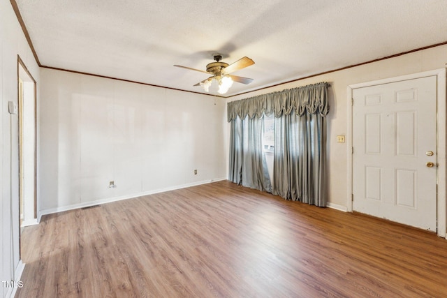 3115 Legion Rd, Hope Mills, NC 28348 - unfurnished room with crown molding, a ceiling fan, wood finished floors, and a textured ceiling