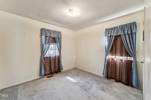 3115 Legion Rd, Hope Mills, NC 28348 - carpeted empty room featuring baseboards and a textured ceiling