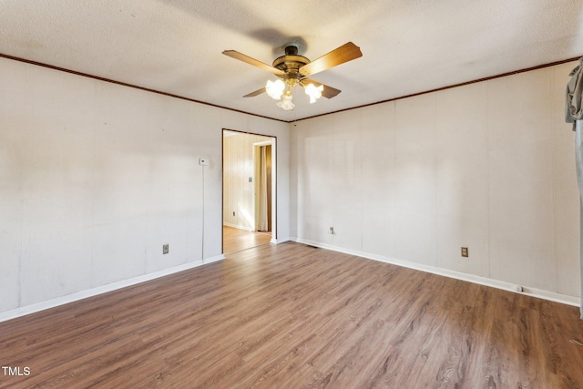 3115 Legion Rd, Hope Mills, NC 28348 - unfurnished room featuring ceiling fan, wood finished floors, a textured ceiling, and crown molding