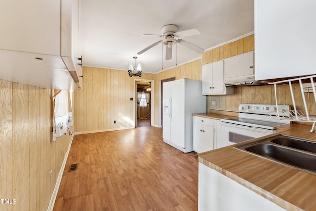 3115 Legion Rd, Hope Mills, NC 28348 - kitchen featuring white appliances, a ceiling fan, under cabinet range hood, white cabinets, and crown molding
