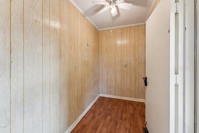 3115 Legion Rd, Hope Mills, NC 28348 - empty room with wood walls, a ceiling fan, wood finished floors, and crown molding