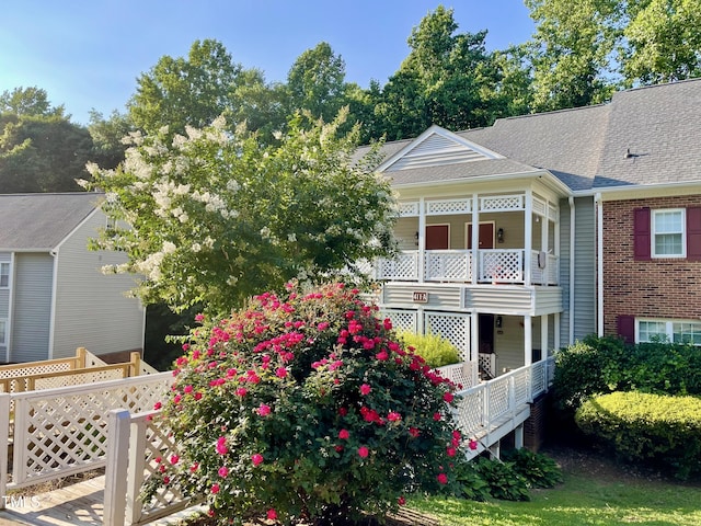 411 Gooseneck Dr Unit A1, Cary, NC 27513 - view of front facade with a shingled roof and brick siding