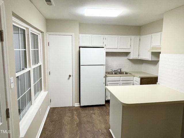 411 Gooseneck Dr Unit A1, Cary, NC 27513 - kitchen featuring freestanding refrigerator, a sink, dark wood-style flooring, white cabinets, and light countertops
