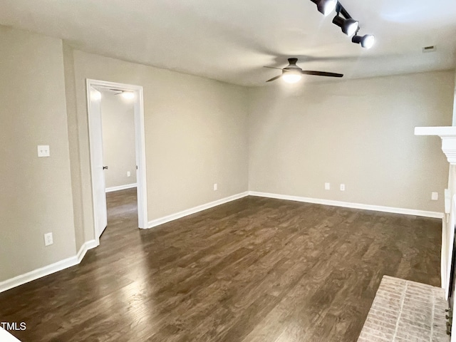 411 Gooseneck Dr Unit A1, Cary, NC 27513 - unfurnished room featuring ceiling fan, dark wood-type flooring, baseboards, and a fireplace