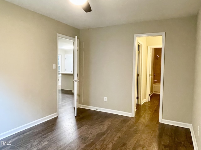411 Gooseneck Dr Unit A1, Cary, NC 27513 - spare room featuring dark wood-style flooring, a ceiling fan, and baseboards