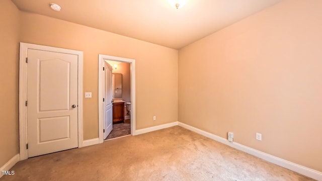 3408 Mount Pisgah Way, Cary, NC 27519 - unfurnished bedroom featuring light carpet, baseboards, and connected bathroom