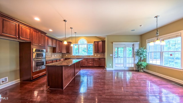 3408 Mount Pisgah Way, Cary, NC 27519 - kitchen featuring double oven, dark wood-type flooring, baseboards, backsplash, and lofted ceiling