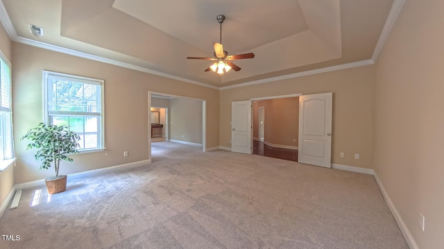 3408 Mount Pisgah Way, Cary, NC 27519 - unfurnished bedroom with a tray ceiling, carpet, baseboards, and crown molding