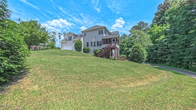 3408 Mount Pisgah Way, Cary, NC 27519 - back of house featuring a garage, stairway, and a lawn