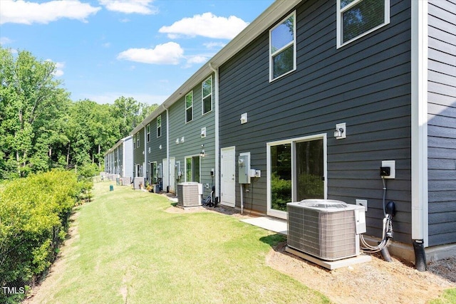 3064 Spline Cir, Raleigh, NC 27610 - back of house with central AC unit and a yard