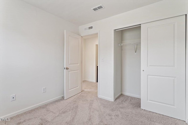 3064 Spline Cir, Raleigh, NC 27610 - unfurnished bedroom featuring light colored carpet, a closet, and baseboards