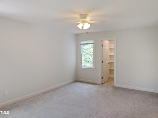 137 Wintermist Dr, Cary, NC 27513 - unfurnished room featuring a ceiling fan, light colored carpet, and baseboards