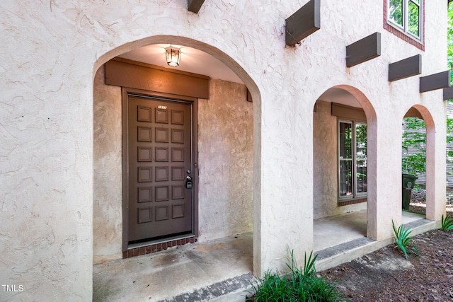 1809-1811 Quail Ridge Rd, Raleigh, NC 27609 - doorway to property featuring stucco siding