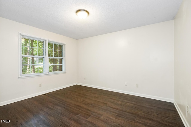 1809-1811 Quail Ridge Rd, Raleigh, NC 27609 - empty room with dark wood finished floors and baseboards