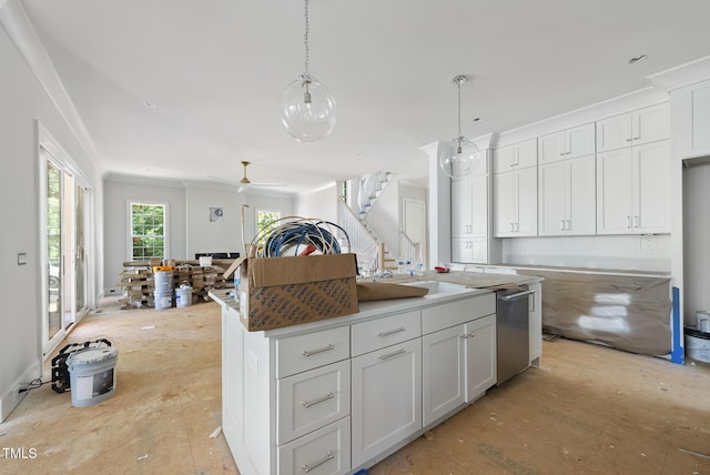 1229 Dixie Trl, Raleigh, NC 27607 - kitchen with a center island, white cabinets, decorative light fixtures, crown molding, and dishwasher