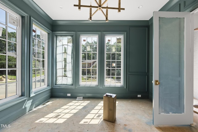 1229 Dixie Trl, Raleigh, NC 27607 - unfurnished sunroom featuring plenty of natural light and a chandelier