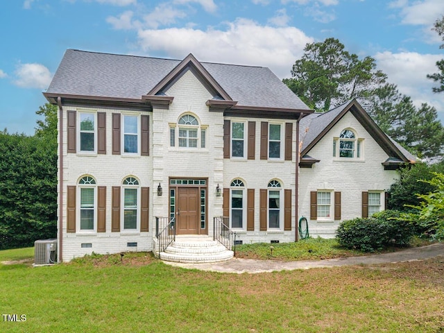 3901 Phlox Rd, Raleigh, NC 27616 - view of front of property featuring crawl space, a front yard, brick siding, and a shingled roof