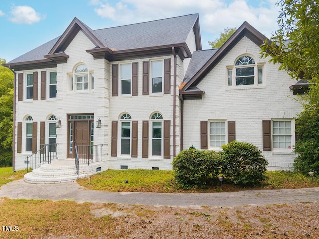 3901 Phlox Rd, Raleigh, NC 27616 - view of front facade featuring brick siding, roof with shingles, and crawl space