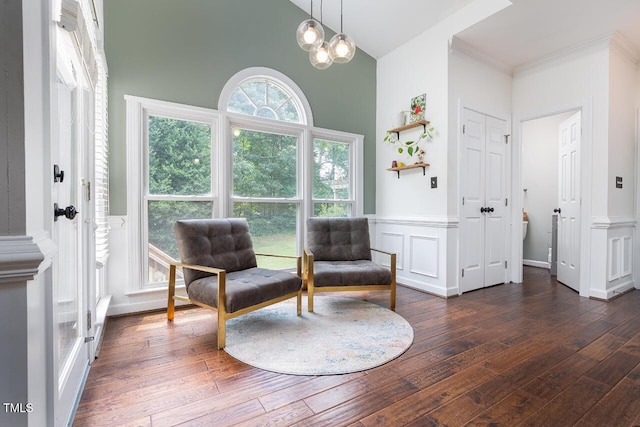 3901 Phlox Rd, Raleigh, NC 27616 - living area featuring hardwood / wood-style floors, high vaulted ceiling, wainscoting, a decorative wall, and ornamental molding