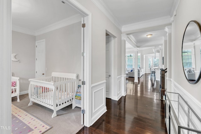 1808 Pennypacker Ln, Durham, NC 27703 - bedroom with crown molding, multiple windows, dark wood finished floors, a wainscoted wall, and a decorative wall