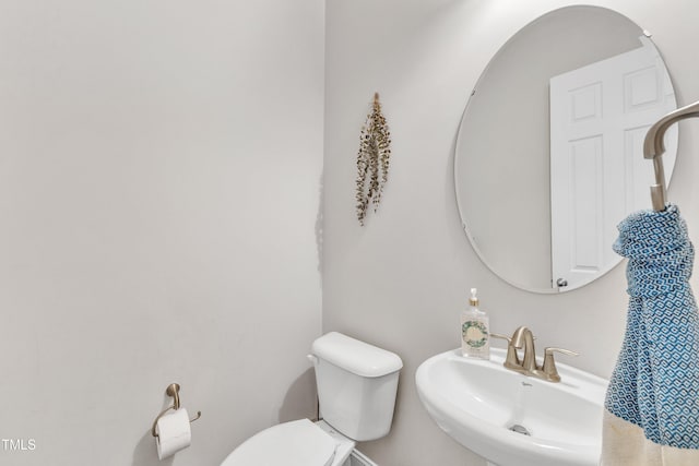 1808 Pennypacker Ln, Durham, NC 27703 - half bath featuring toilet and a sink