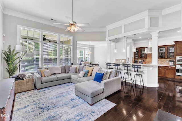 1808 Pennypacker Ln, Durham, NC 27703 - living area featuring a ceiling fan, dark wood-style floors, crown molding, decorative columns, and recessed lighting