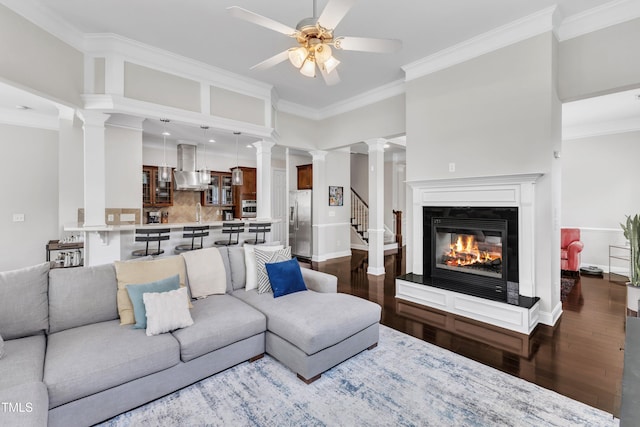 1808 Pennypacker Ln, Durham, NC 27703 - living area featuring crown molding, ceiling fan, decorative columns, and dark wood finished floors