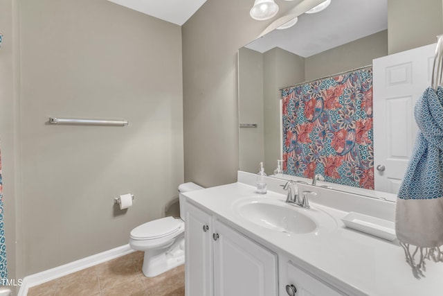 1808 Pennypacker Ln, Durham, NC 27703 - bathroom with vanity, toilet, baseboards, tile patterned floors, and a shower with shower curtain