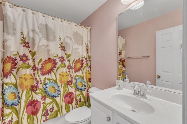 1808 Pennypacker Ln, Durham, NC 27703 - bathroom with vanity, toilet, and a shower with curtain
