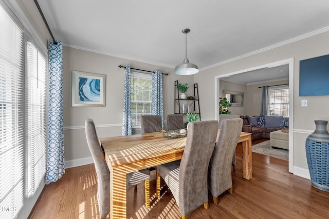 5412 Farley Dr, Raleigh, NC 27609 - dining room featuring wood finished floors and ornamental molding