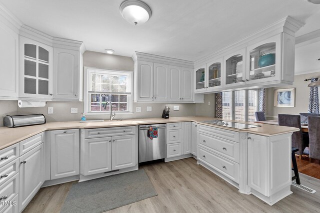 5412 Farley Dr, Raleigh, NC 27609 - kitchen with dishwasher, electric cooktop, white cabinets, and light wood finished floors